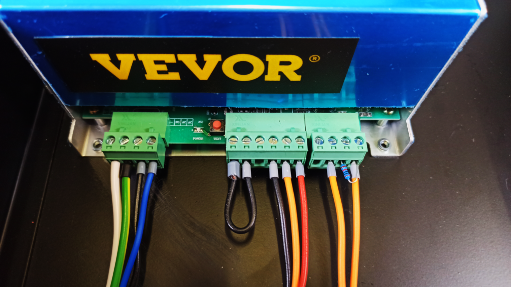 Connections to the commercial laser power supply: Mains voltage input (left connector), output voltage adjustment (center connector) and enable / disable input (right connector)